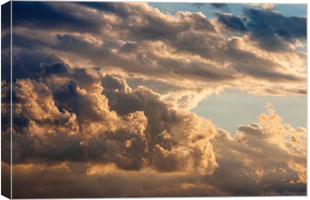 Colorful cloudy sky at sunset. Canvas Print by Arpad Radoczy