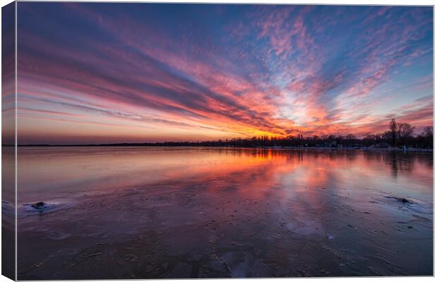 Beautiful sunset light in winter over lake Balaton Canvas Print by Arpad Radoczy