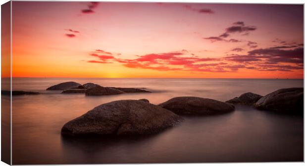 Sunrise over the rocks Canvas Print by Arpad Radoczy