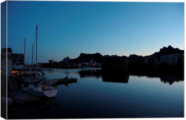 A boat is docked in a harbor at the blue hour, in a fjord Canvas Print by Alessandro Della Torre