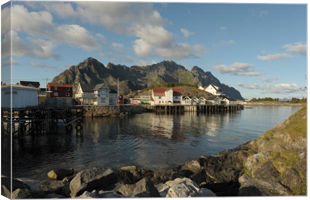 Lofoten island in front of water with a mountain in the background Canvas Print by Alessandro Della Torre