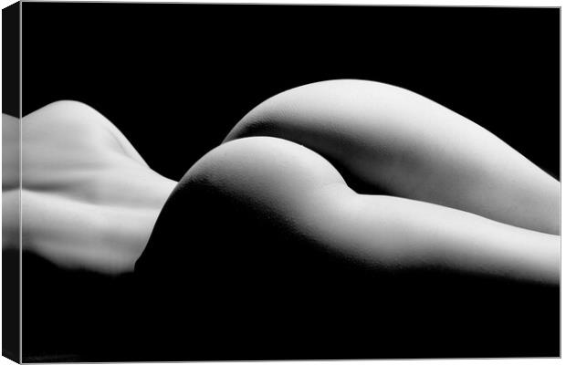 ass of a woman naked and nude fine art photography bodyscape laying on black studio background Canvas Print by Alessandro Della Torre