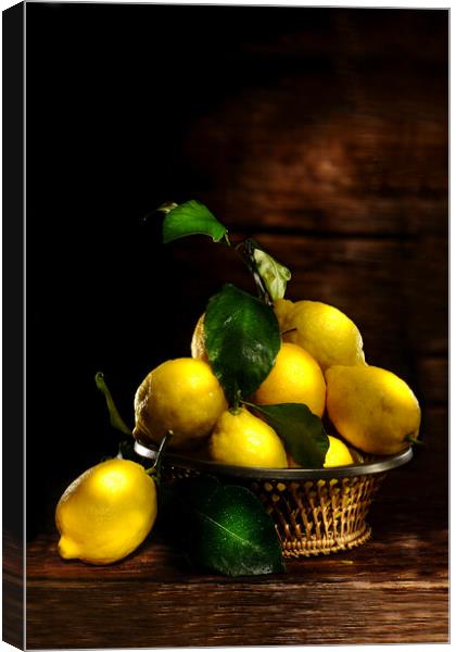lemons on wood table Canvas Print by Alessandro Della Torre