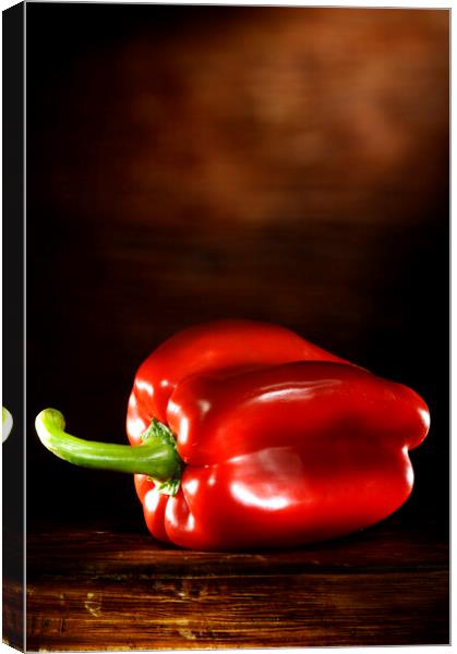 Red Pepper on a wood table Canvas Print by Alessandro Della Torre