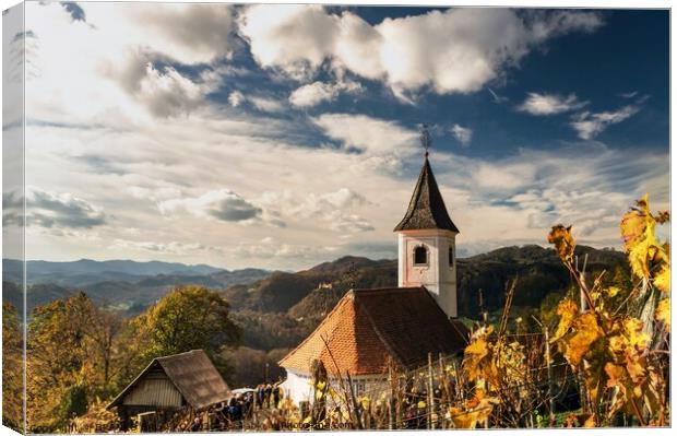 A church with a mountain in the background Canvas Print by BRANKO BALAŠKO