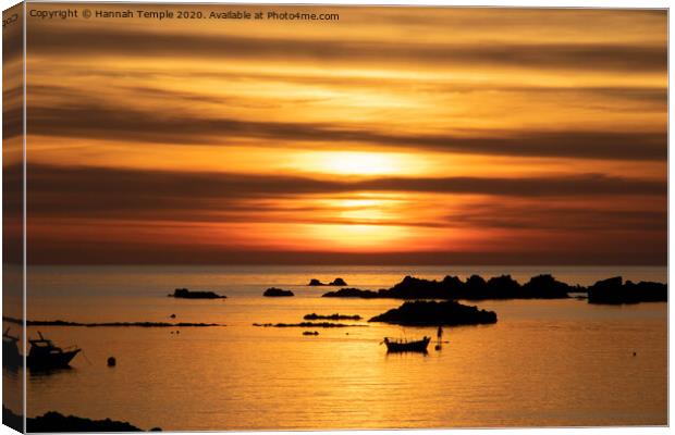 Sunset at Cobo Bay Canvas Print by Hannah Temple