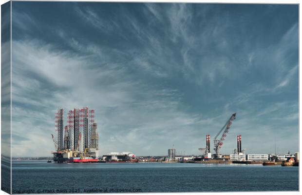 Oil and Wind power rigs in Esbjerg harbor. Denmark Canvas Print by Frank Bach