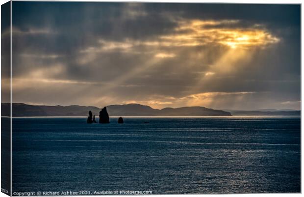 Dramatic sky lights up the Drongs, Shetland Canvas Print by Richard Ashbee