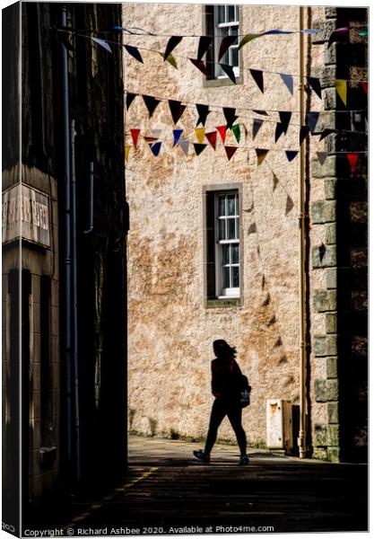 A person in Silhouette in the lane  Canvas Print by Richard Ashbee