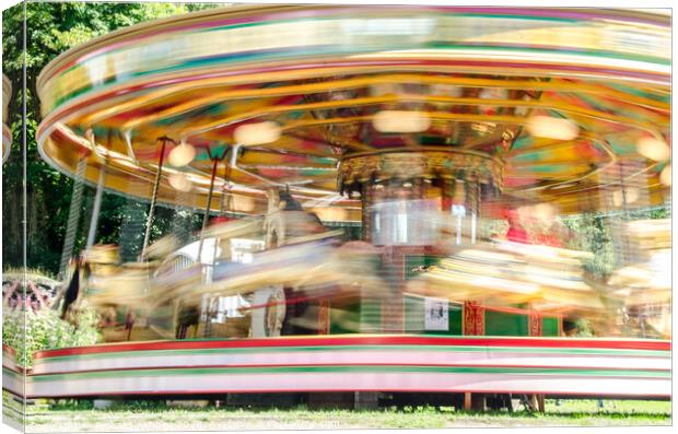 Carousel spinning  Canvas Print by Richard Ashbee