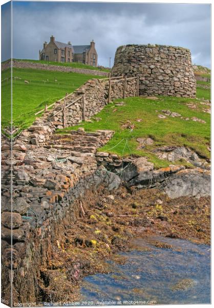 Lunna harbour and historic house in Shetland Canvas Print by Richard Ashbee