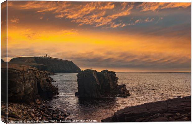 A sunset over Sumburgh Head in Shetland Canvas Print by Richard Ashbee