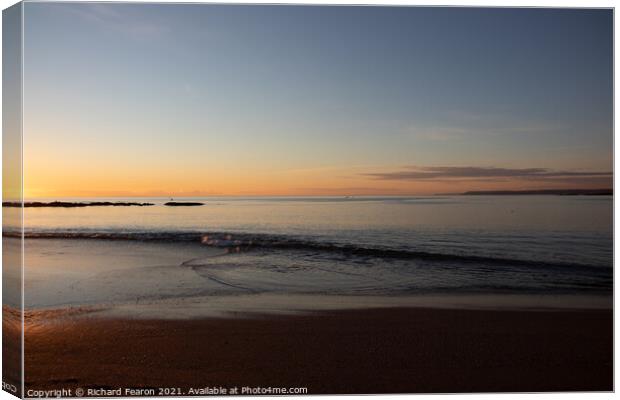 Warm sun reflecting off the sea in Devon Canvas Print by Richard Fearon