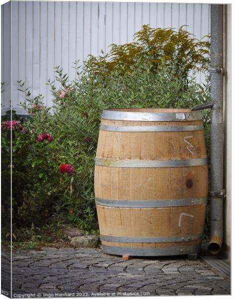 A vertical shot of an old big wooden rain barrel in the garden Canvas Print by Ingo Menhard