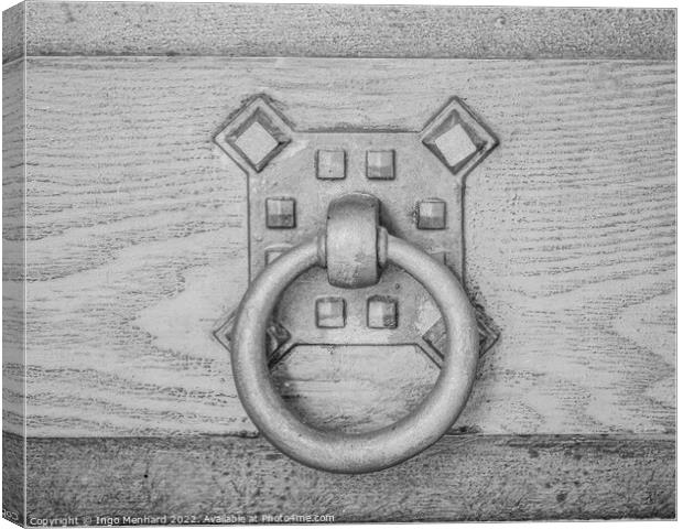 A closeup shot of an old metal doorknob on a wooden door Canvas Print by Ingo Menhard