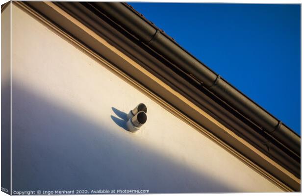 Low angle shot of a surveillance camera on a building Canvas Print by Ingo Menhard
