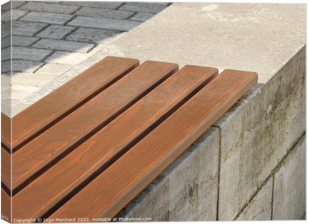 A part of a wooden bench in the park Canvas Print by Ingo Menhard