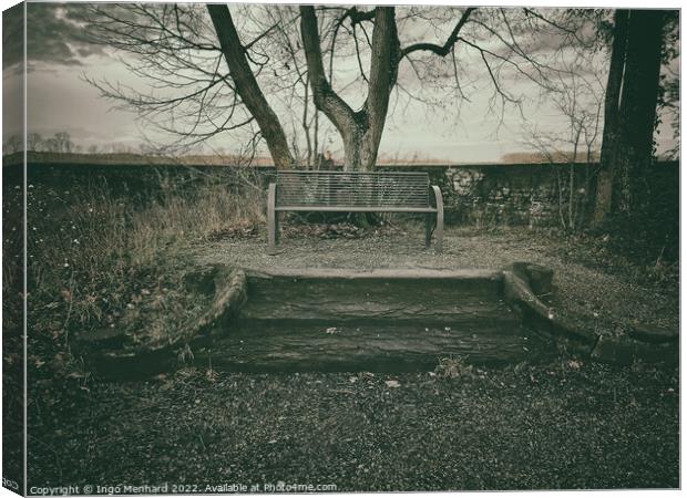 Mysterious autumn scene with a single empty bench Canvas Print by Ingo Menhard