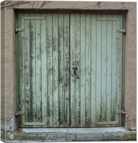 The old wooden green door with a rusty lock and handle Canvas Print by Ingo Menhard
