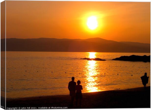 Greek Island sunset Canvas Print by john hill