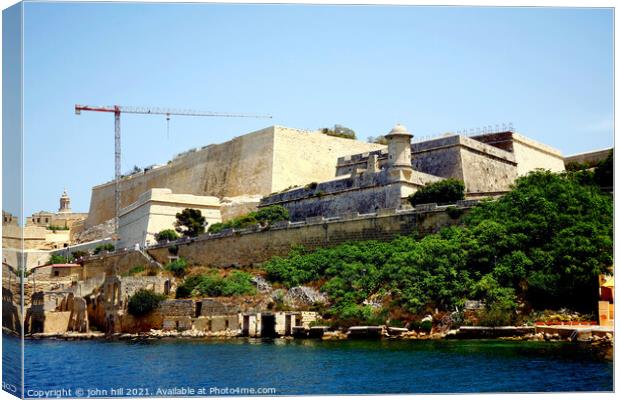 Fortifications at Valletta, Malta. Canvas Print by john hill