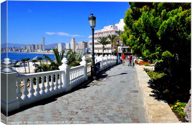 Walkway on the seafront at Benidorm, Spain. Canvas Print by john hill