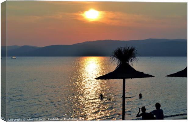 Sunset at Agia Eleni beach, Skiathos, Greece. Canvas Print by john hill