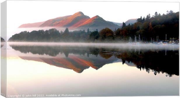 Morning reflections on Derwentwater Canvas Print by john hill