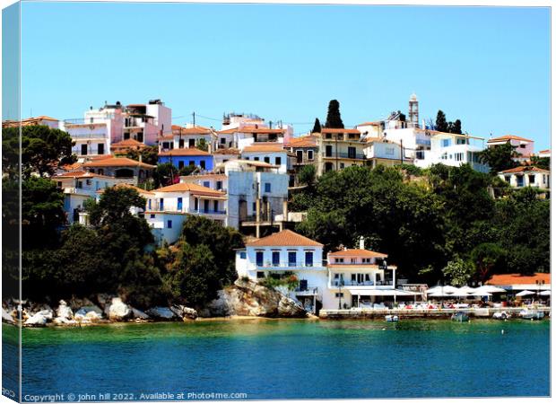 Skiathos town from the sea. Canvas Print by john hill