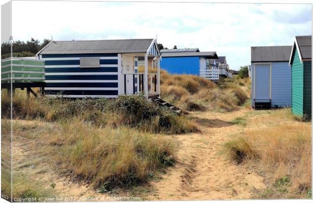 Sand dunes beach huts, Old Hunstanton, Norfolk. Canvas Print by john hill