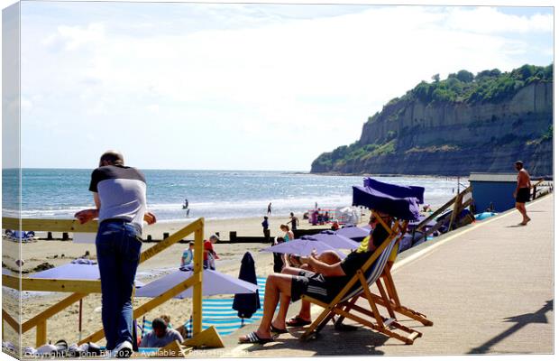 Relaxation, Clock tower beach Shanklin, Isle of Wight. Canvas Print by john hill