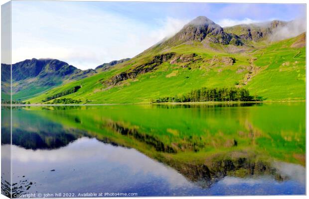 Mountain reflections, Cumbria, UK. Canvas Print by john hill