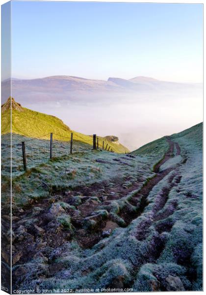 Looking down to a misty Winnats pass, Derbyshire. Canvas Print by john hill