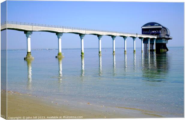 Tranquil Reflections of Bembridge Lifeboat Station Canvas Print by john hill