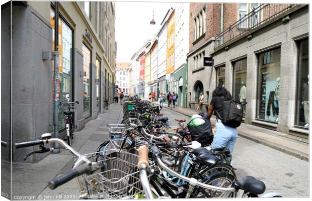 Back street bicycle Parking Copenhagen Denmark Canvas Print by john hill
