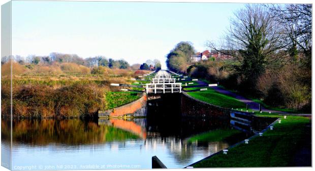 Caen hill canal locks, Devizes, Wiltshire, UK. Canvas Print by john hill