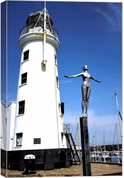 Harbour lighthouse and bathing belle statue at Scarborough. Canvas Print by john hill