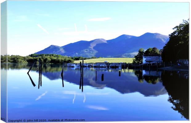Reflections in Derwentwater with Skiddaw mountain  Canvas Print by john hill