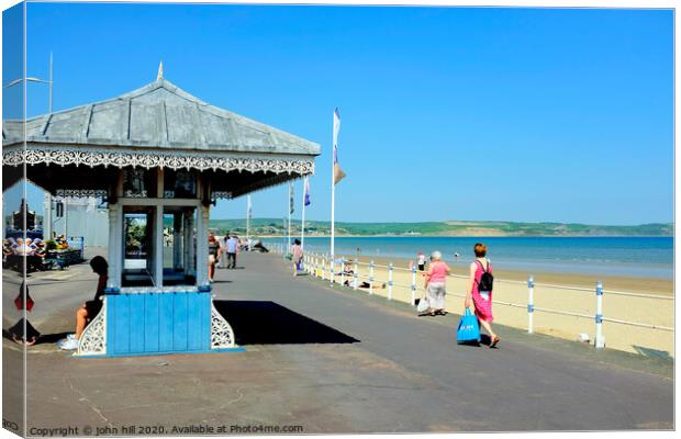 Victorian seaside shelter and beach at Weymouth in Dorset.  Canvas Print by john hill