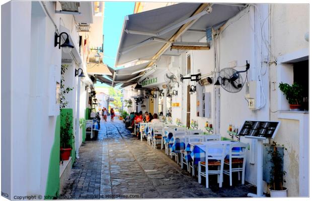 Food and drink in a back alley of Skiathos town in Greece.   e Canvas Print by john hill
