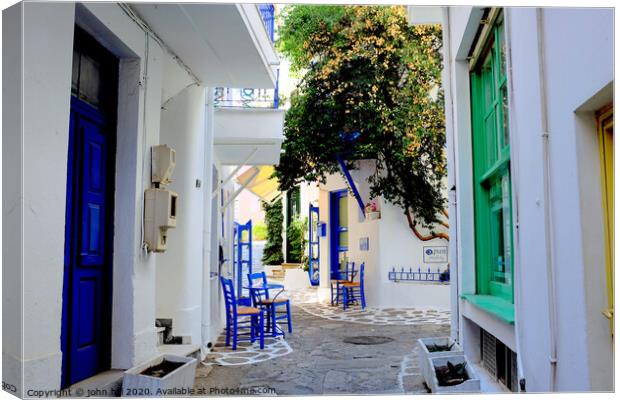 Back street in Skiathos town Greece. Canvas Print by john hill