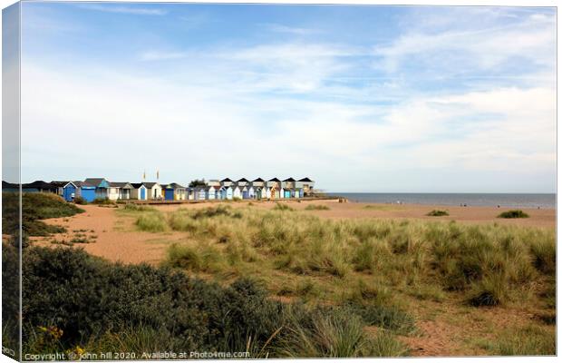 Beach huts at Chapel point at Chapel St. Leonards in Lincolnshire. Canvas Print by john hill