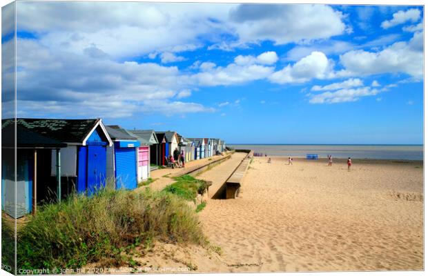Beach and beach huts at Chapel Point at Chapel St. Leonards in Lincolnshire.  Canvas Print by john hill
