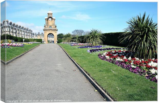 The Holbeck clock tower and South cliff gardens at Scarborough in Yorkshire.  Canvas Print by john hill
