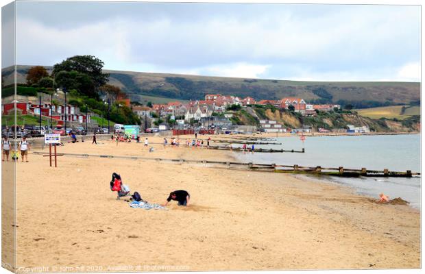 Swanage beach during October in Dorset. Canvas Print by john hill