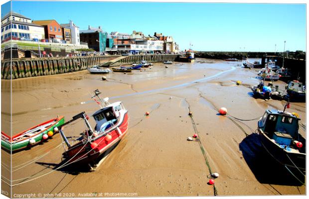 Harbour and quay during low tide at Bridlington in Yorkshire. Canvas Print by john hill