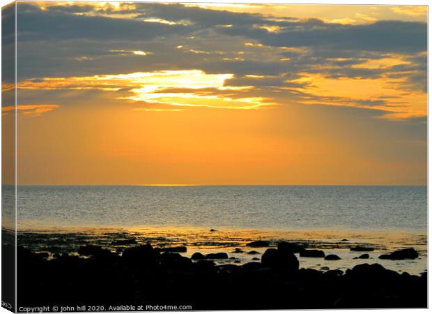 Sunset over Cardigan bay in Wales. Canvas Print by john hill