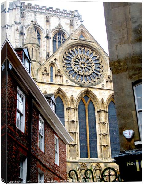York Minster rose window and tower at York in Yorkshire. Canvas Print by john hill