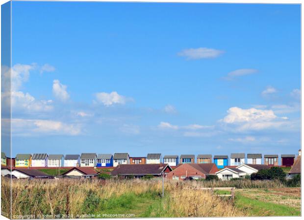 The backs of beach huts at Sandilands in Lincolnshire Canvas Print by john hill