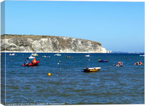 Swanage bay in Dorset, UK. Canvas Print by john hill
